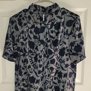 Navy and White patterned blouse with knot detail